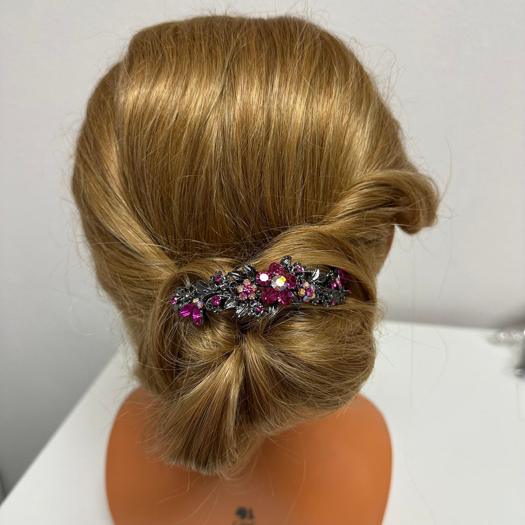 Updo hairstyle showing  the curved design barrette for thick hair in pink fuchsia crystals