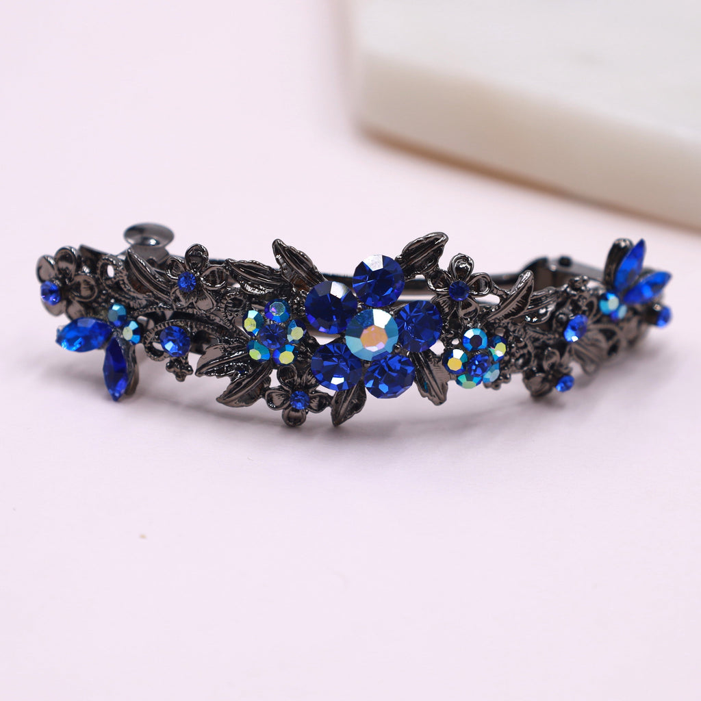 royal blue hair accessory ith royal blue crystals and ab crystals in a gunmetal gray body barrette