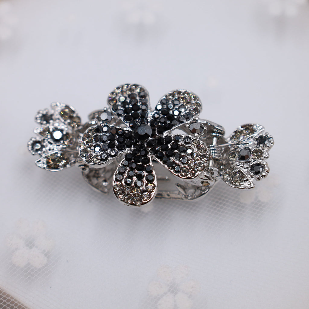 Elegant black rhinestone flower hair claw for a classic formal look