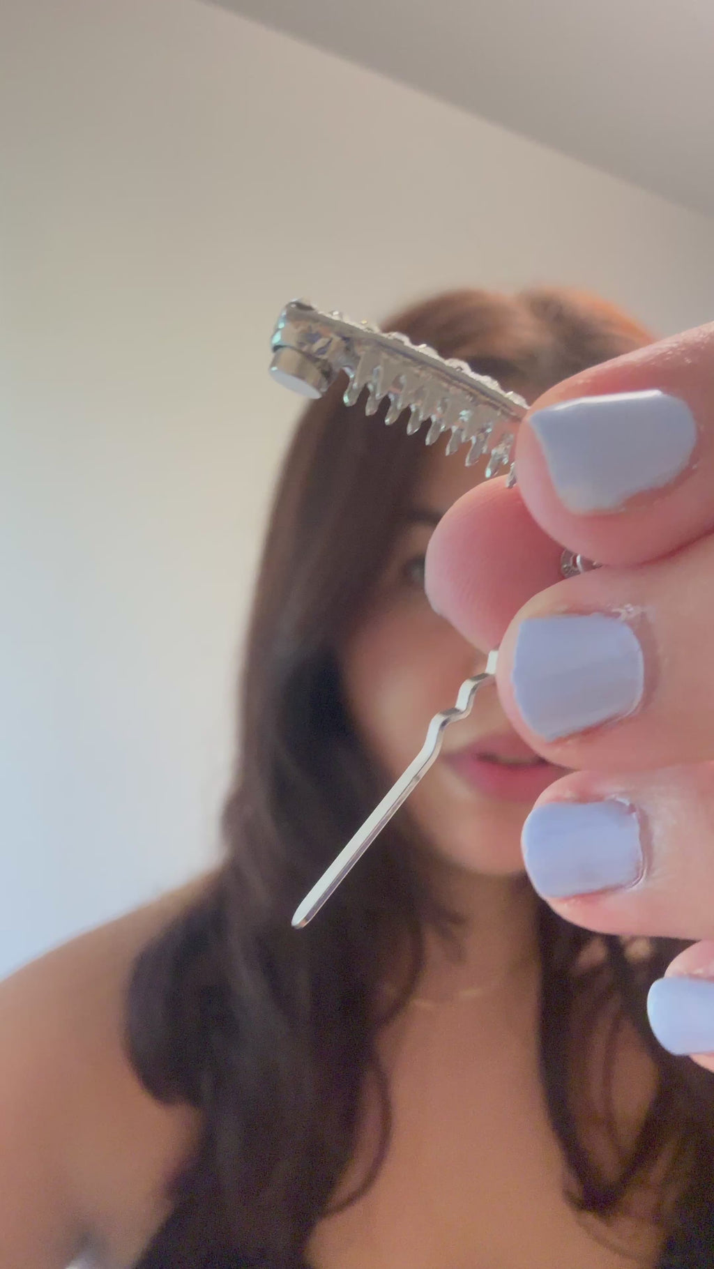 How to use a slim magnetic hair clip for fine hair, showing the magnetic closure and how it holds a small side section in place.