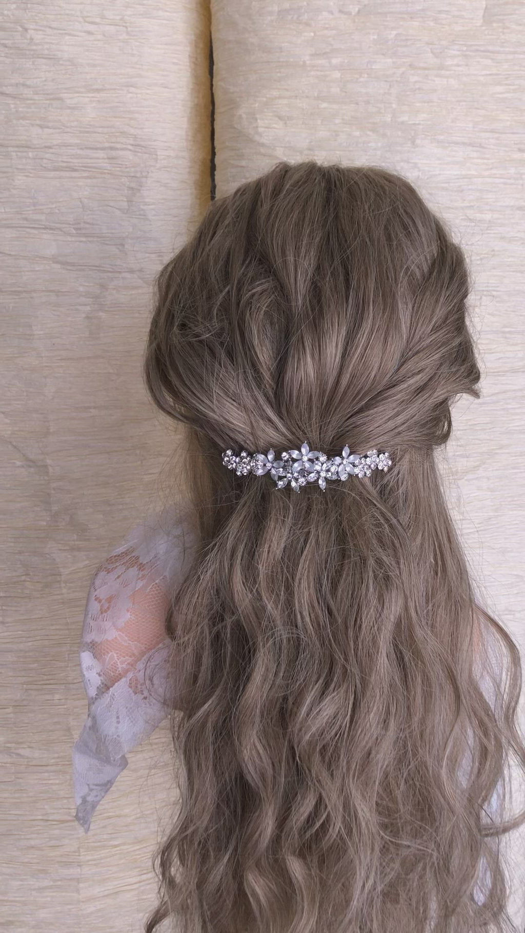A long hair barrette with a crystal flower design for weddings