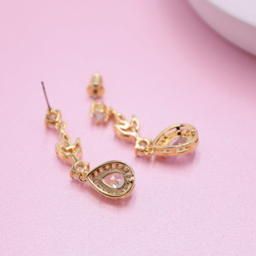 Elegant gold earrings for brides, featuring intricate crystals for a touch of opulent brilliance.