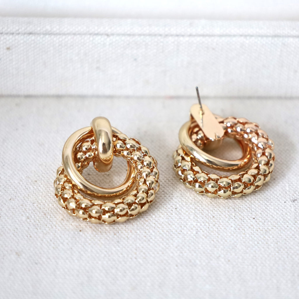 Gold earrings to elevate your aesthetic look.