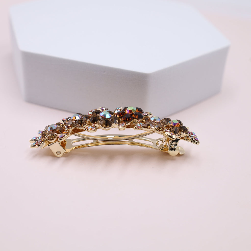 Elegant crystal hair barrette featuring amber and topaz color crystals.