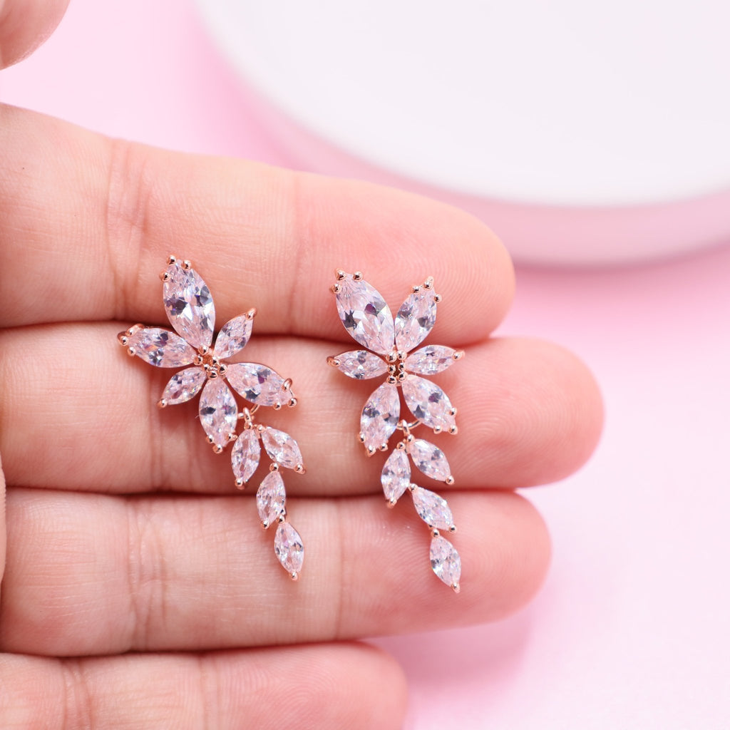 Chic rose gold earrings for weddings, embellished with dazzling clear crystals for a touch of glamour.