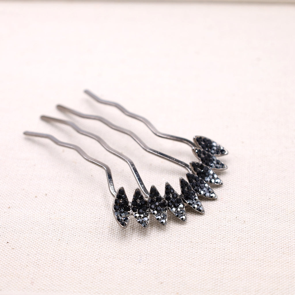 Sleek black hair stick - a modern and minimalist accessory for versatile hairstyles.