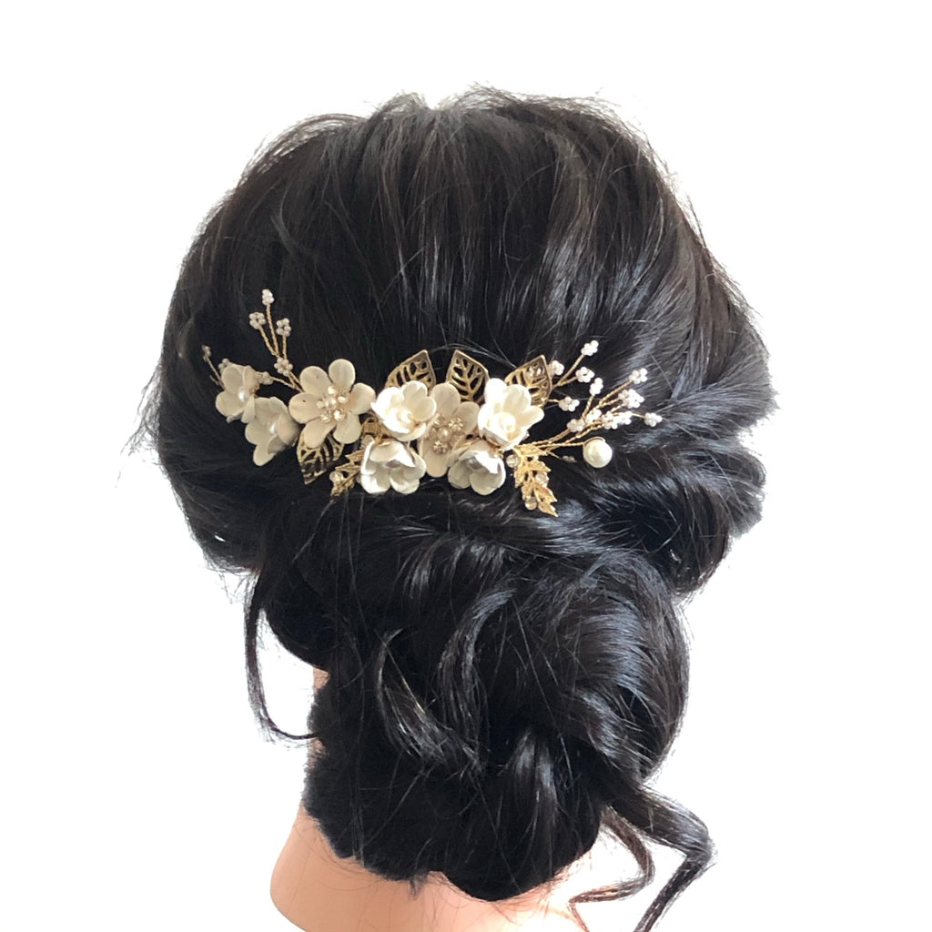 updo hairstyle with a white floral hair comb for bride or bridesmaids