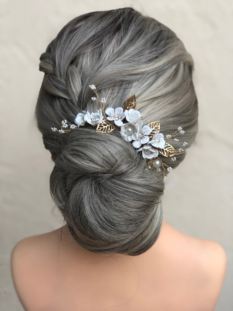 bride hairstyle with a white floral hair comb